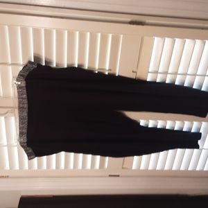 2 pc Black with animal print around neck of pajamas and top of pajama pant set